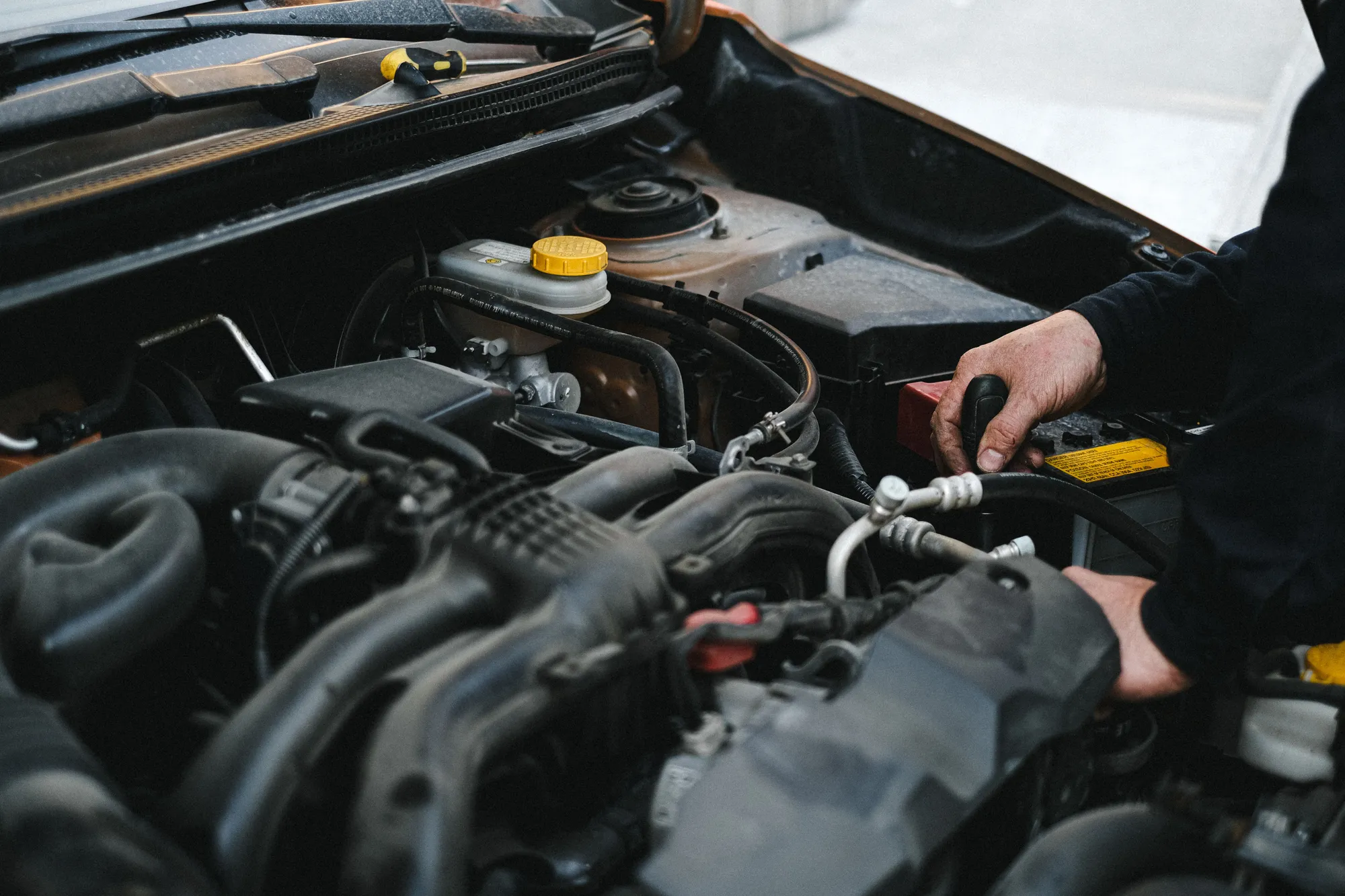 Technician working on a car engine at Eskimo Auto Repair in Edmonton